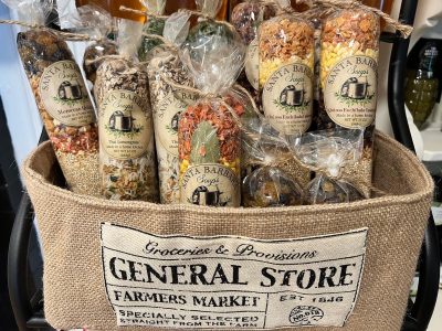 Assorted packaged soup mixes in clear bags displayed in a burlap basket labeled "General Store Farmers Market.