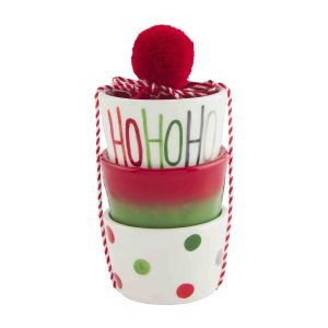 Three stacked holiday-themed bowls with red string and a red pom-pom, featuring festive colors and patterns.