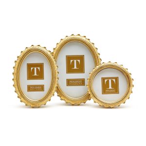 Three ornate, oval-shaped gold picture frames of different sizes displayed against a white background.