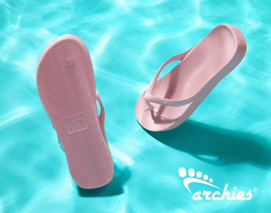 Two pink Archies flip-flops floating in a blue swimming pool with the Archies logo in the bottom right corner.