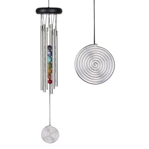 A metal wind chime with spiral designs and colorful beads hanging in the center.