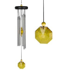 Silver wind chime with a yellow faceted crystal pendant and bead hanging from a black circular top.