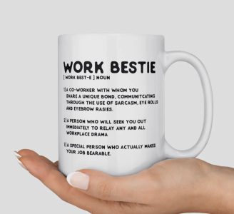 A hand holds a white mug labeled "Work Bestie" with definitions describing a close, supportive coworker.