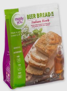 A package of molly&you Beer Bread Mix, Italian Herb flavor, with an image of sliced bread and herbs on the front.