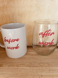A white mug labeled "before work" and a clear glass labeled "after work" sit side by side on a wooden surface.