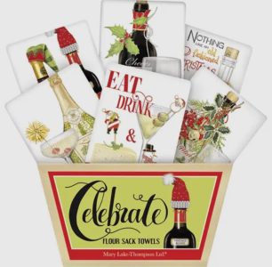 A gift box labeled "Celebrate" contains festive flour sack towels featuring holiday drinks and Christmas decorations.