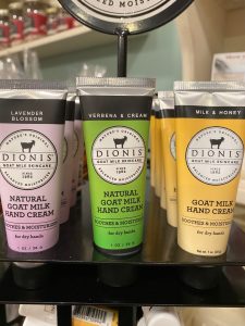 Three varieties of Dionis goat milk hand cream—Lavender Blossom, Verbena & Cream, and Milk & Honey—on display.