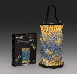 A patterned Modgy origami lantern with dragonfly design is displayed next to its matching product box on a gray background.