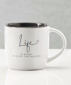White ceramic mug with black interior and the text “Life is short. Do stuff that matters.” printed on the side.