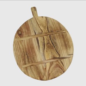 Round wooden cutting board with a short handle, featuring natural wood grain patterns, on a white background.